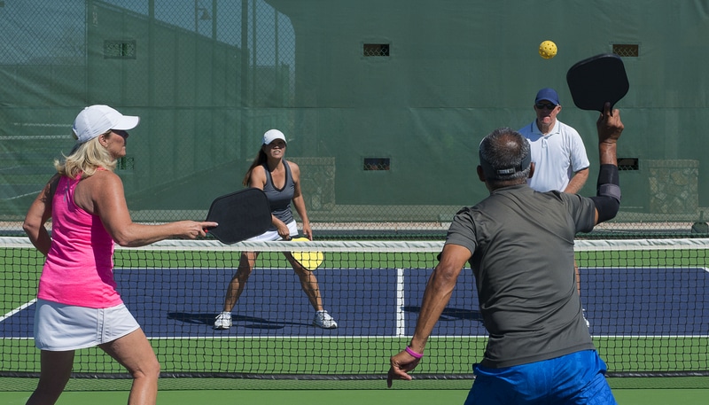 What are the Differences in Play Between Singles and Doubles Pickleball